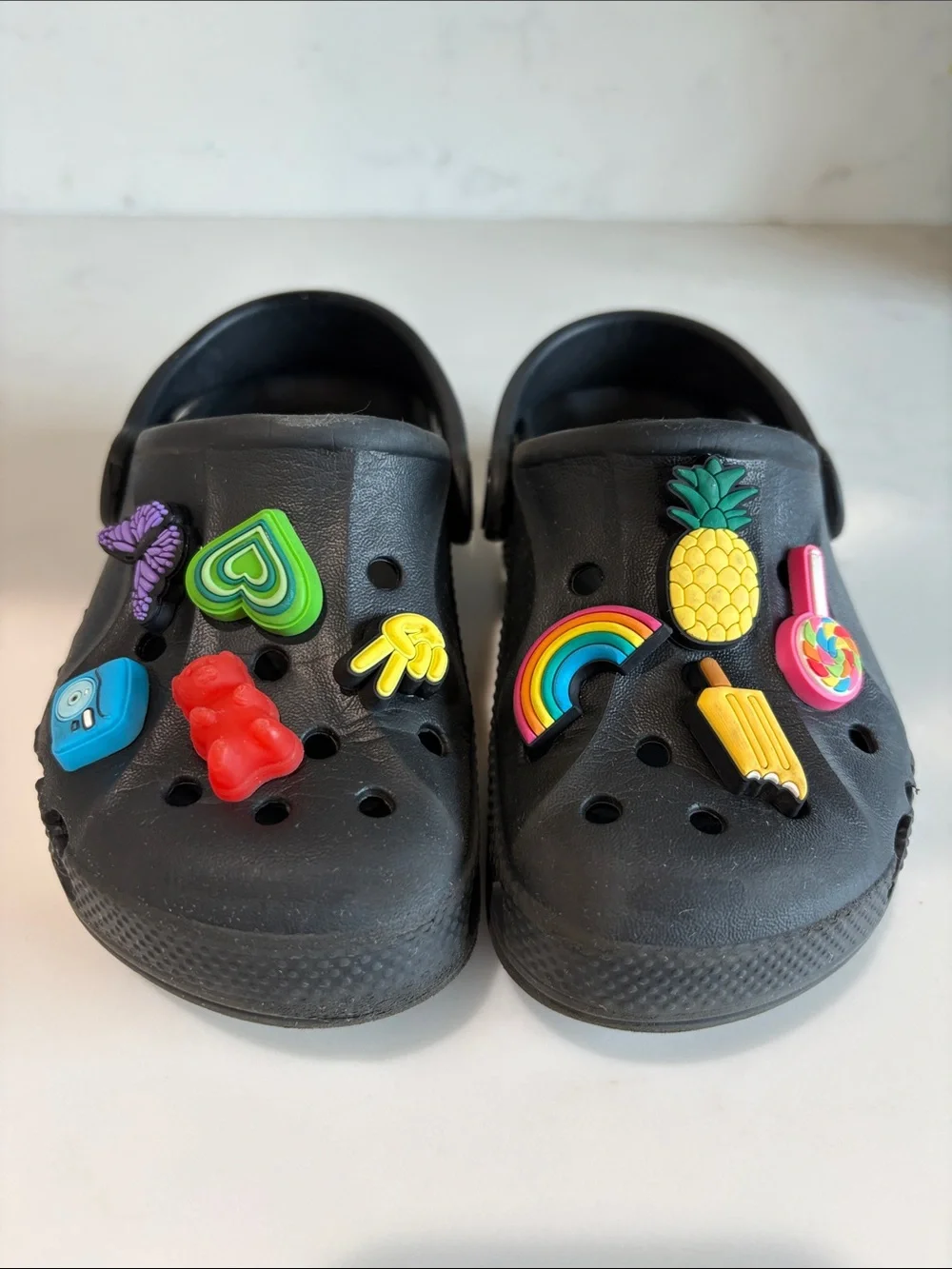 CROCS Kids Black Clogs with Colorful Charm Pins